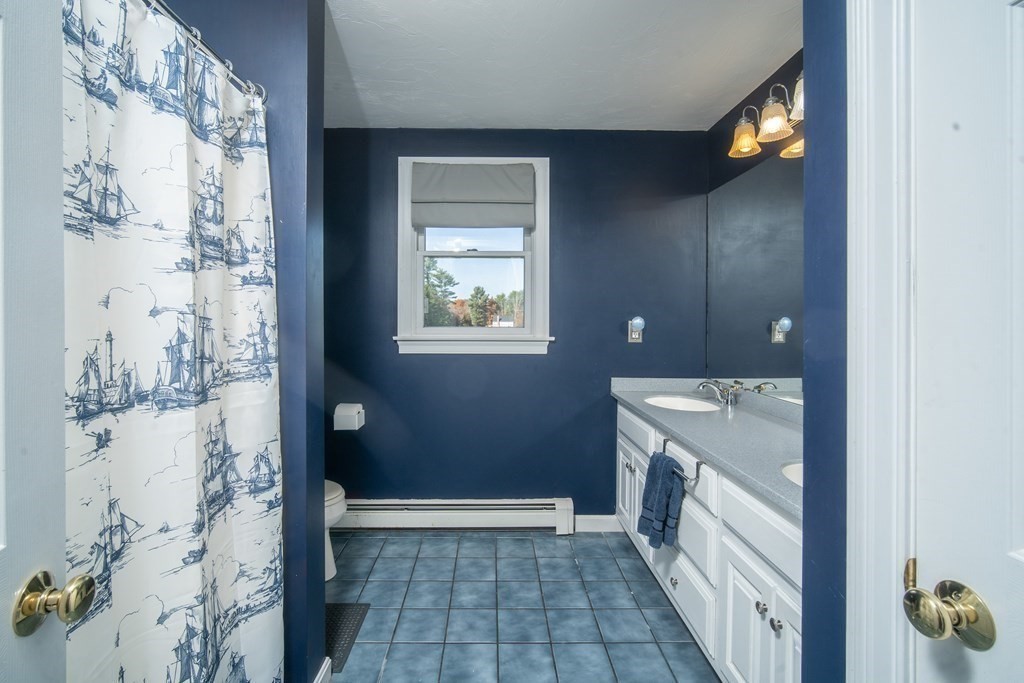 151 Fuller Street Middleboro, MA 02346 - Photo 14 of 24 a view of a bathroom with a sink and shower