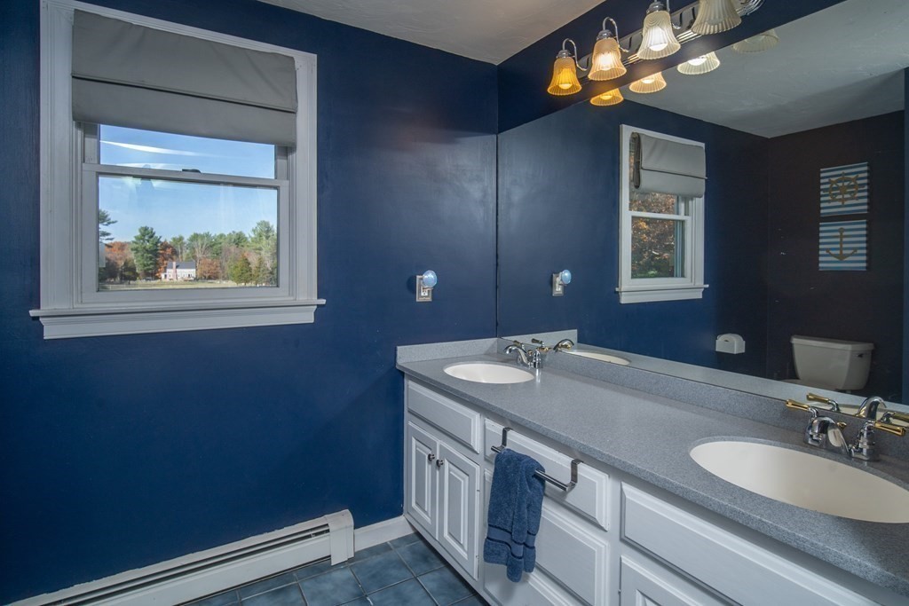 151 Fuller Street Middleboro, MA 02346 - Photo 15 of 24 a bathroom with a sink a vanity and a mirror