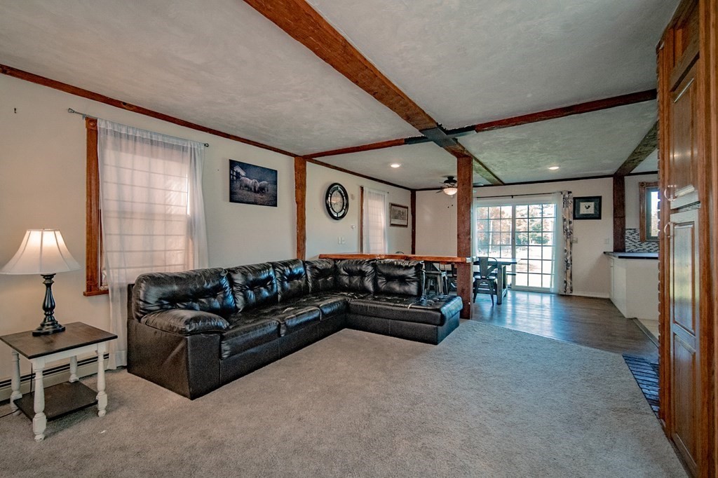 151 Fuller Street Middleboro, MA 02346 - Photo 4 of 24 a living room with furniture and a fireplace