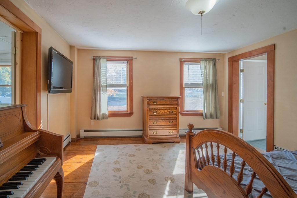 151 Fuller Street Middleboro, MA 02346 - Photo 6 of 24 a view of an empty room with furniture window and wooden floor