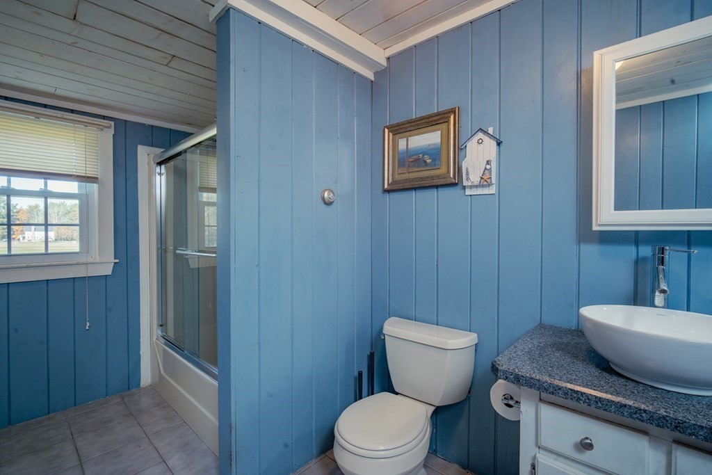 151 Fuller Street Middleboro, MA 02346 - Photo 8 of 24 a bathroom with a granite countertop toilet and a sink