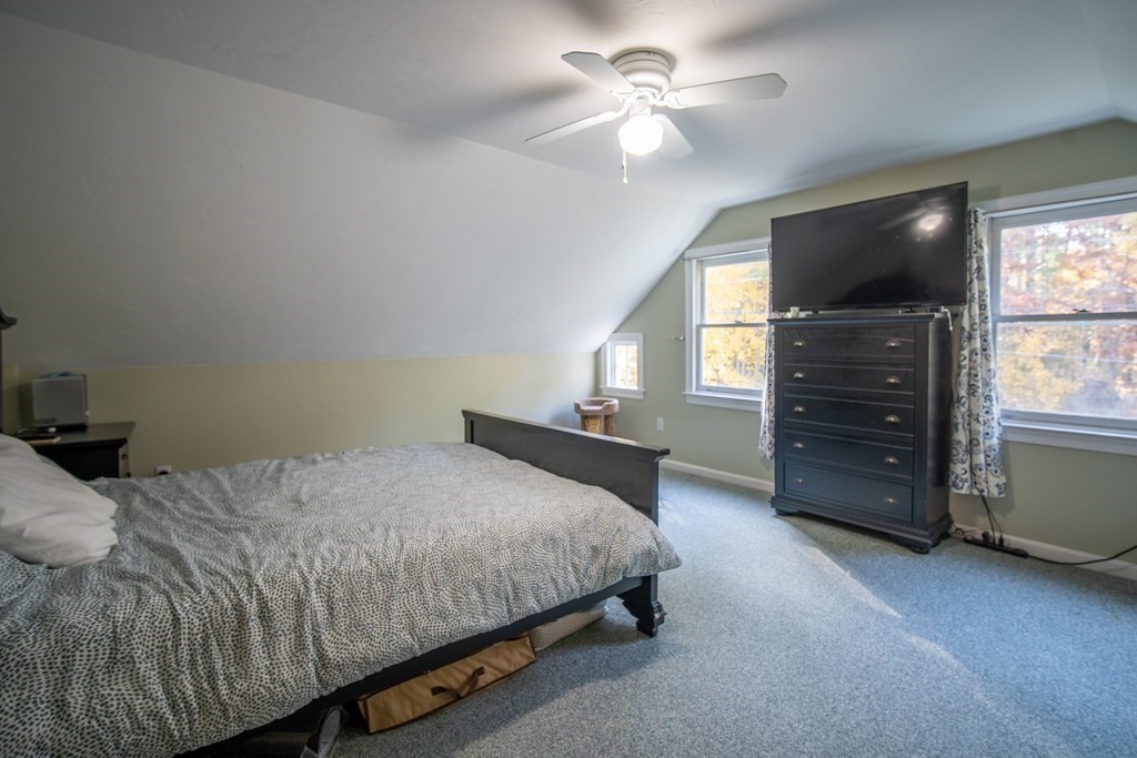 151 Fuller Street Middleboro, MA 02346 - Photo 9 of 24 a bedroom with a bed and a flat screen tv