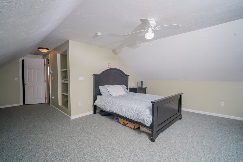 151 Fuller Street Middleboro, MA 02346 - Photo 10 of 24 a bedroom with a bed and a ceiling fan
