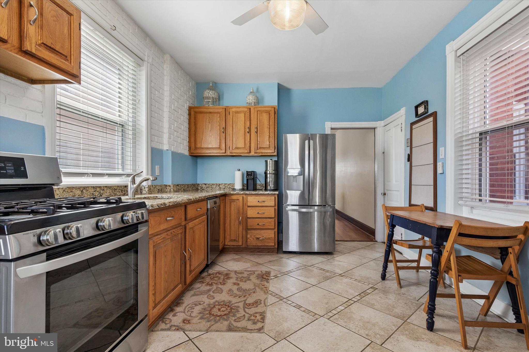 35 North Ridge Avenue Ambler, PA 19002 - Photo 8 of 15 a kitchen with stainless steel appliances granite countertop a stove a sink dishwasher and a refrigerator