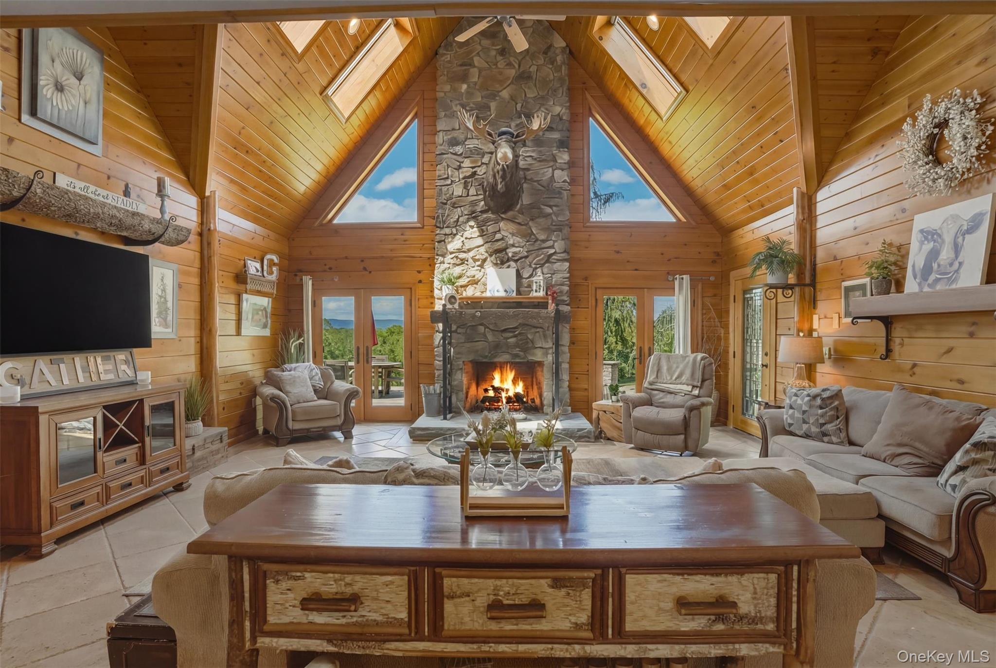 95 Judson Road Montgomery, NY 12549 - Photo 10 of 50 The dramatic great room serves as the heart of the home with floor-to-ceiling windows and a striking stone fireplace.
