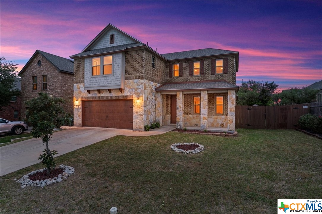 1101 Yellow Iris Road Leander, TX 78641 - Photo 1 of 1 a front view of a house with a yard