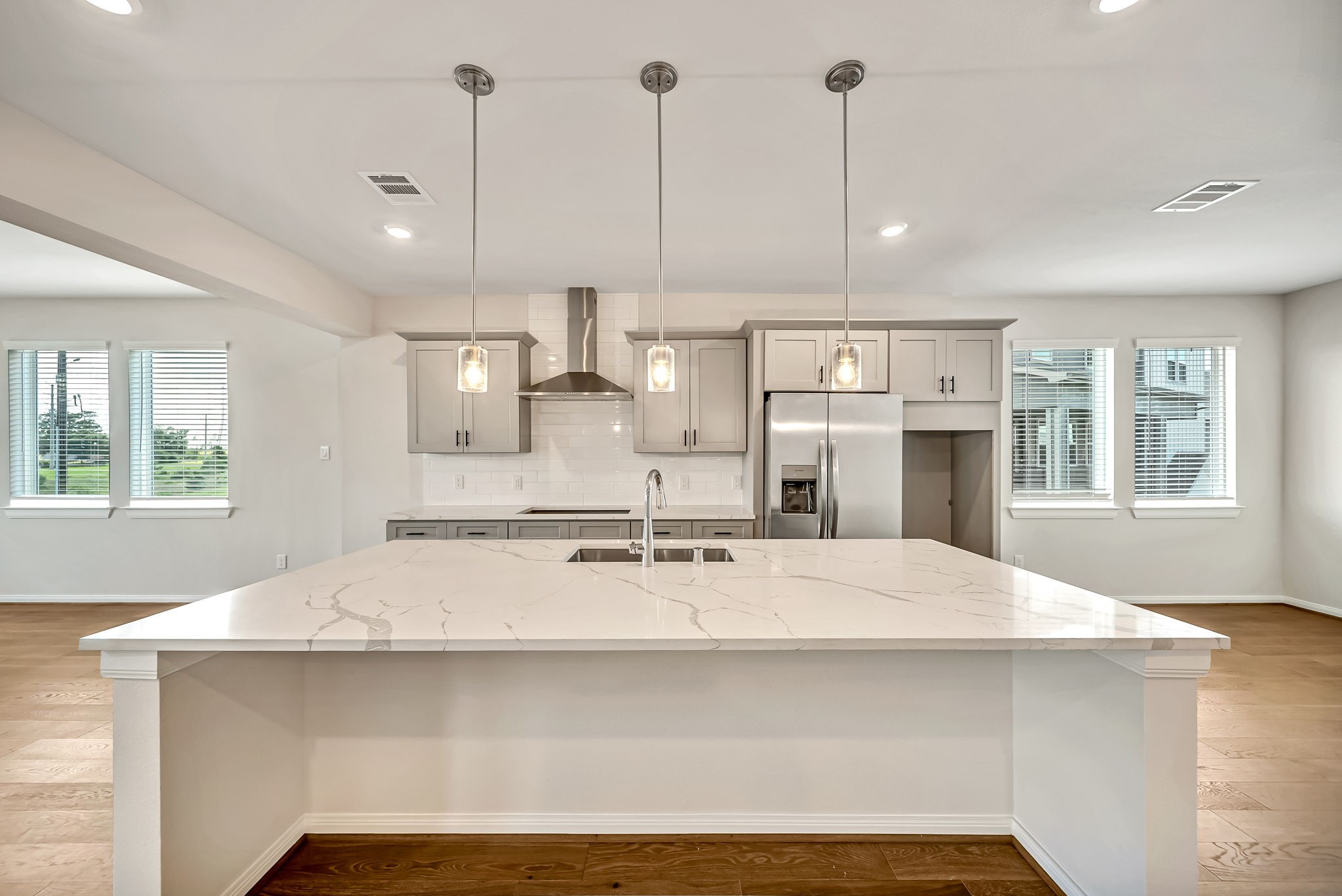 20629 Dynamic Court Humble, TX 77338 - Photo 5 of 26 a large kitchen with kitchen island a sink stainless steel appliances and window