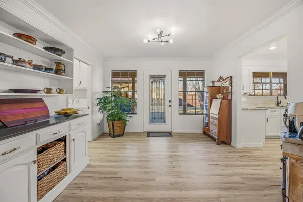 a kitchen that has a lot of cabinets and refrigerator