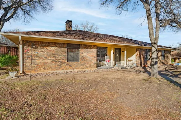 front view of a house with a large window