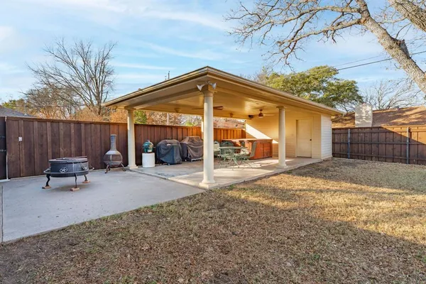 a view of a backyard with a patio