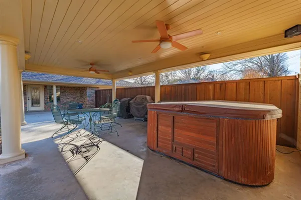 a view of a backyard with sitting area