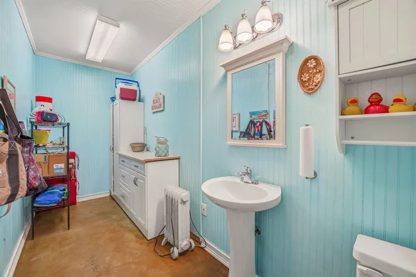a bathroom with a sink a vanity and a mirror