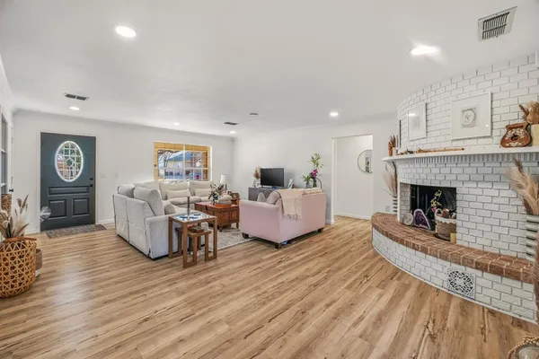 a living room with furniture and a fireplace