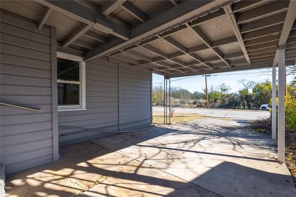 a view of porch with wooden floor