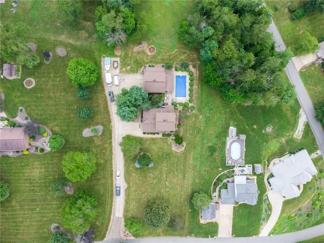 an aerial view of a house with a garden and yard