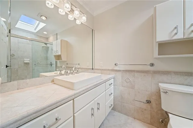 a bathroom with a sink double vanity and a shower
