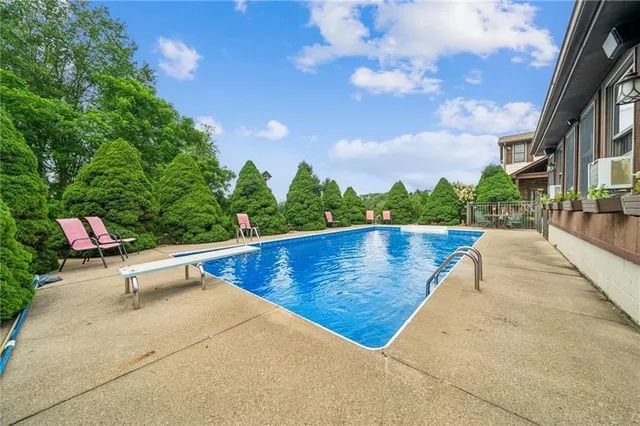 a view of a backyard with sitting area