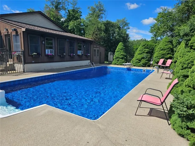 a kitchen with white cabinets and appliances