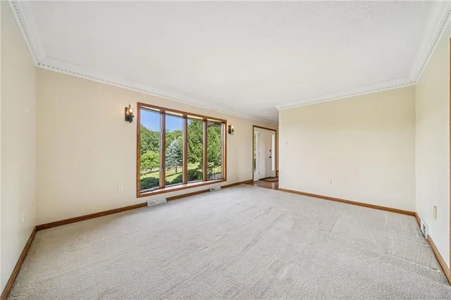 an empty room with windows and view