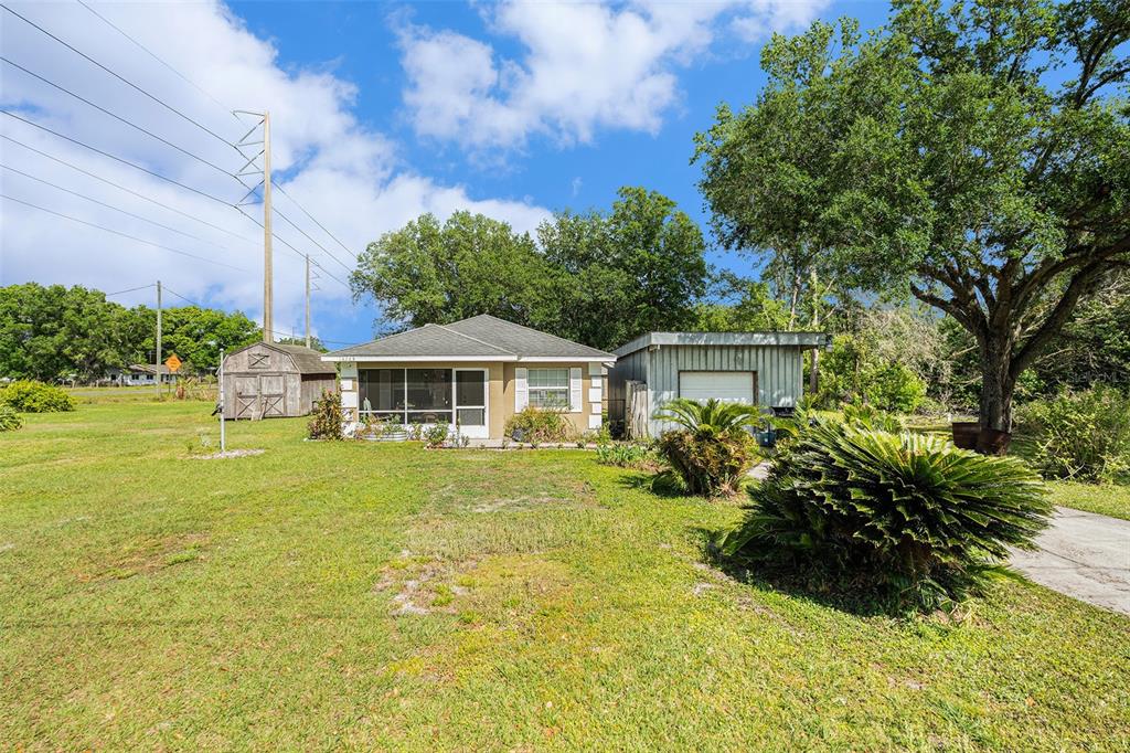 14285 O'Conner Road Kathleen, FL 33849 - Photo 1 of 1 a front view of a house with yard and green space