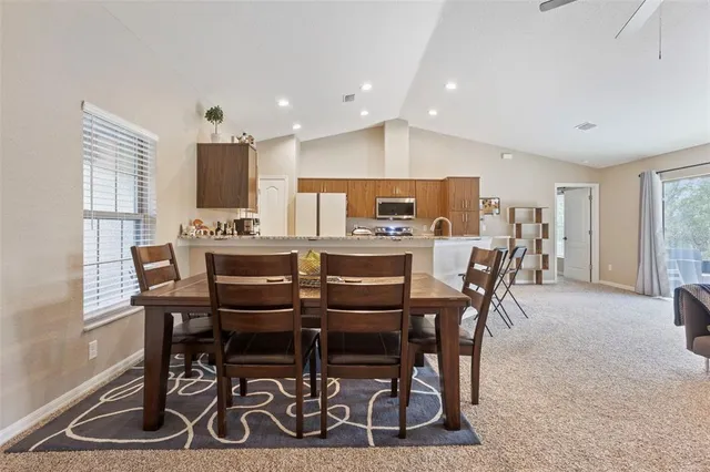 a view of a dining room with furniture