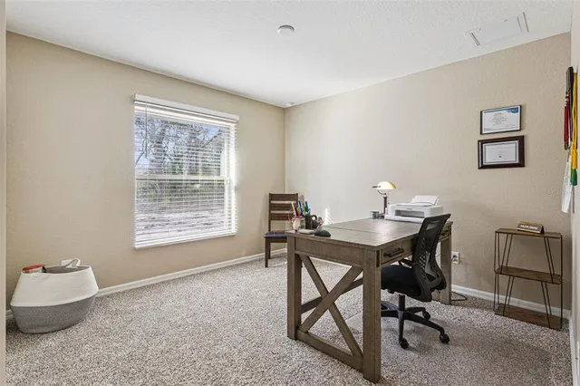 a workspace with furniture and window