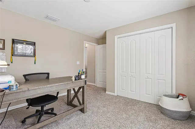 a view of a workspace with furniture