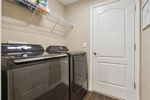 a utility room with washer and dryer