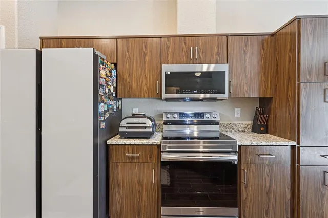 a kitchen with a stove and a microwave