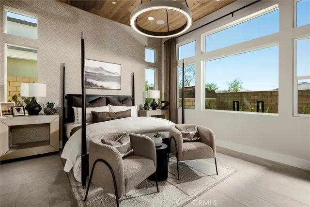 a bedroom with a bed and a mirror