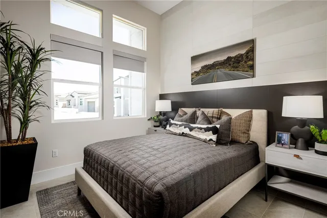 a bedroom with bed and window