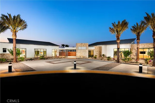 a front view of house with yard and trees