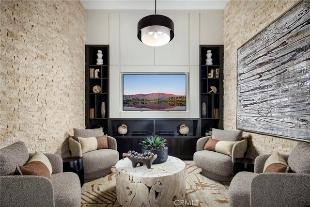 a living room with furniture a rug and a wall painting