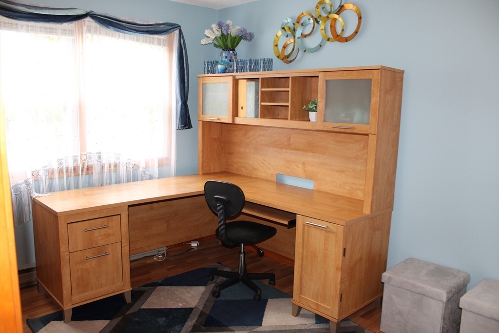 28 State Street Chicopee, MA 01013 - Photo 18 of 25 a view of a workspace with furniture and a window