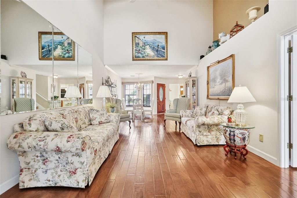 116 Baytree Boulevard Tavares, FL 32778 - Photo 12 of 47 a living room with furniture and wooden floor