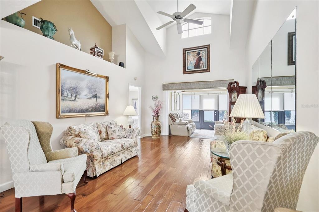 116 Baytree Boulevard Tavares, FL 32778 - Photo 14 of 47 a living room with furniture and painting on the wall