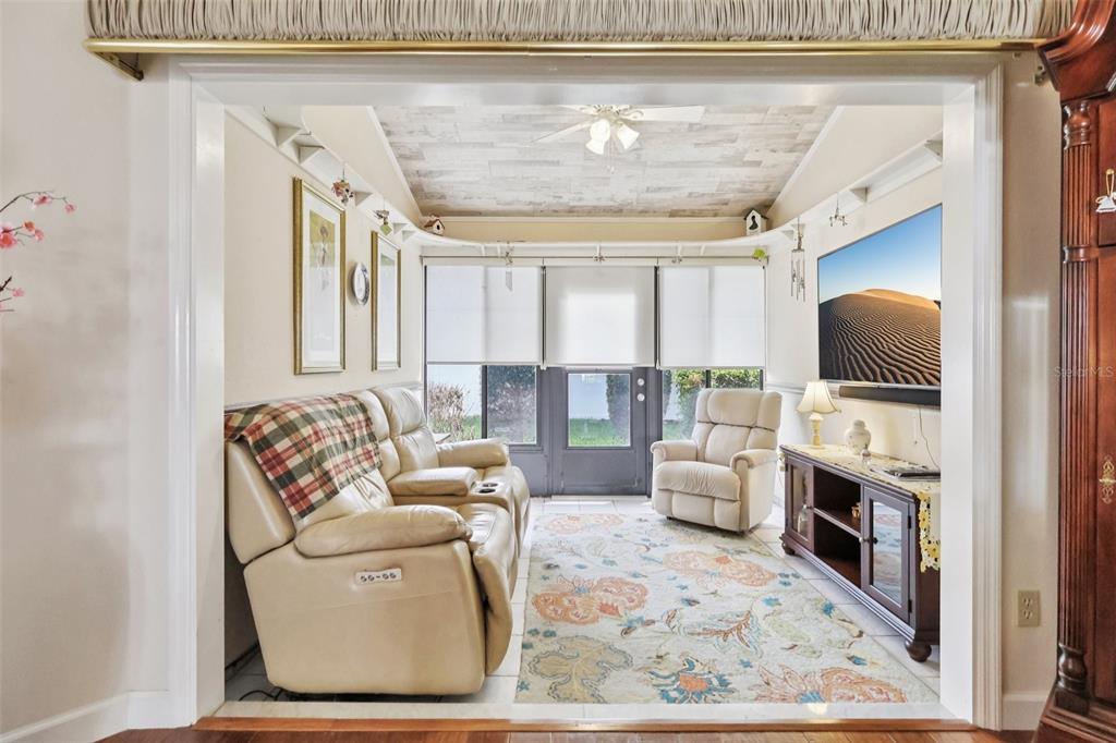 116 Baytree Boulevard Tavares, FL 32778 - Photo 15 of 47 a living room with furniture a fireplace and a flat screen tv