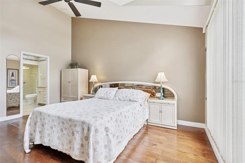 116 Baytree Boulevard Tavares, FL 32778 - Photo 17 of 47 a bedroom with a bed and a table