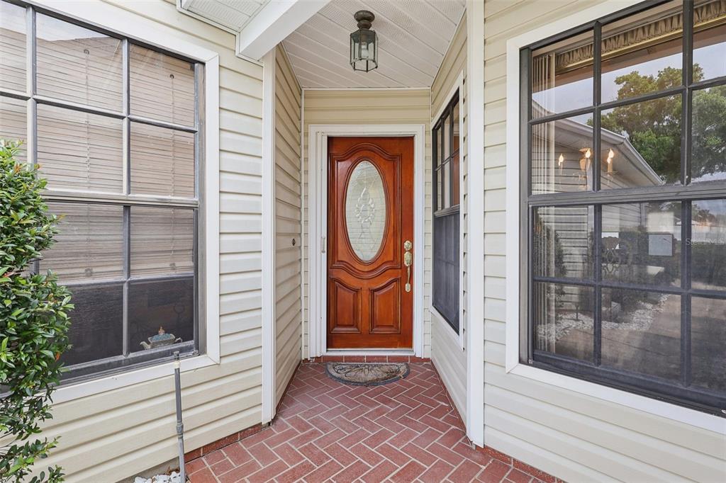 116 Baytree Boulevard Tavares, FL 32778 - Photo 2 of 47 a view of a entryway door front of house