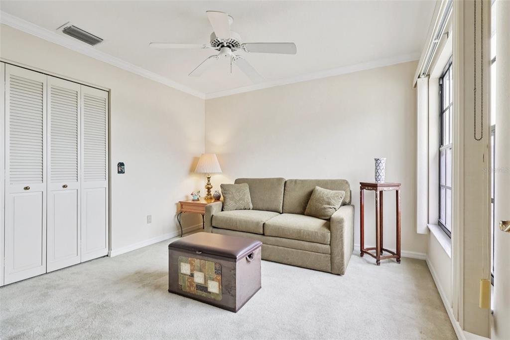116 Baytree Boulevard Tavares, FL 32778 - Photo 23 of 47 a living room with furniture a ceiling fan and a window