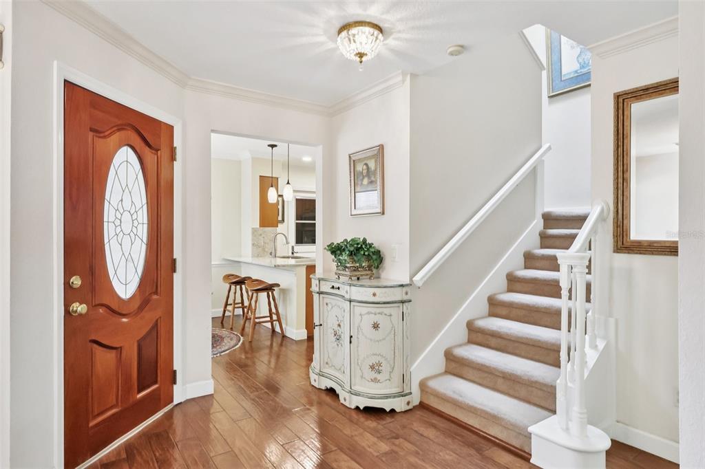 116 Baytree Boulevard Tavares, FL 32778 - Photo 3 of 47 a view of entryway livingroom and hall with wooden floor