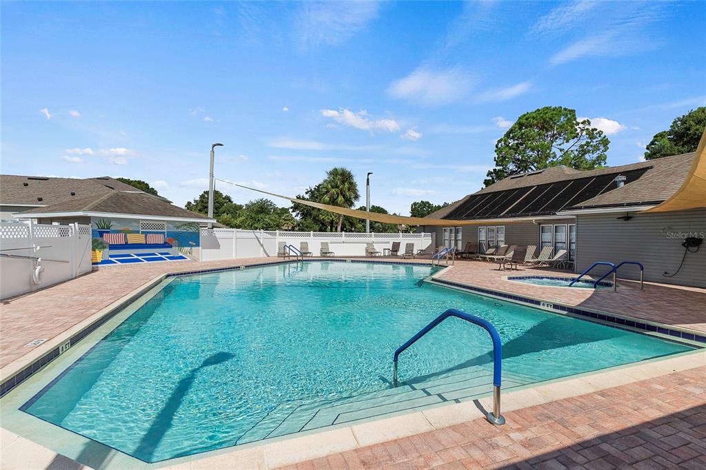 116 Baytree Boulevard Tavares, FL 32778 - Photo 32 of 47 a view of a swimming pool with a lounge chairs