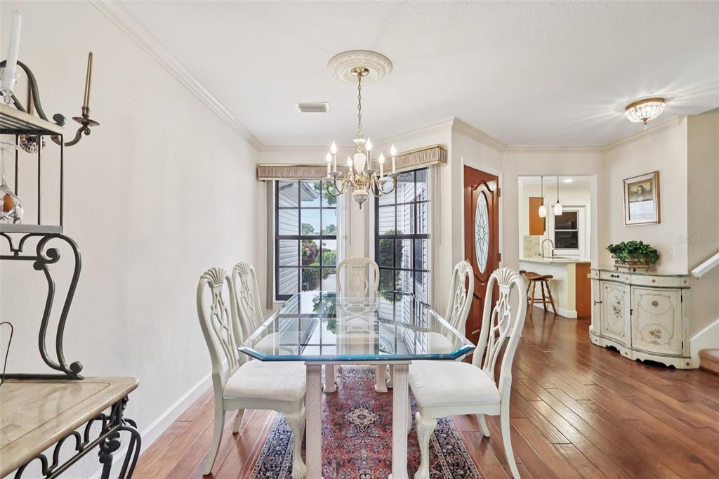 116 Baytree Boulevard Tavares, FL 32778 - Photo 10 of 47 a view of a dining room with furniture window and wooden floor
