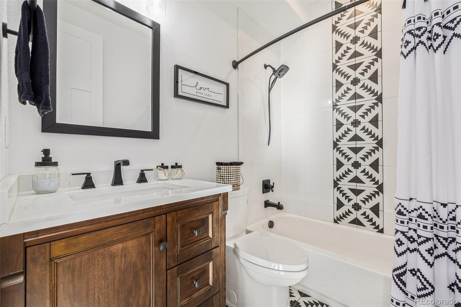 663 Brookside Drive Bailey, CO 80421 - Photo 25 of 47 a bathroom with a sink a toilet and a bathtub