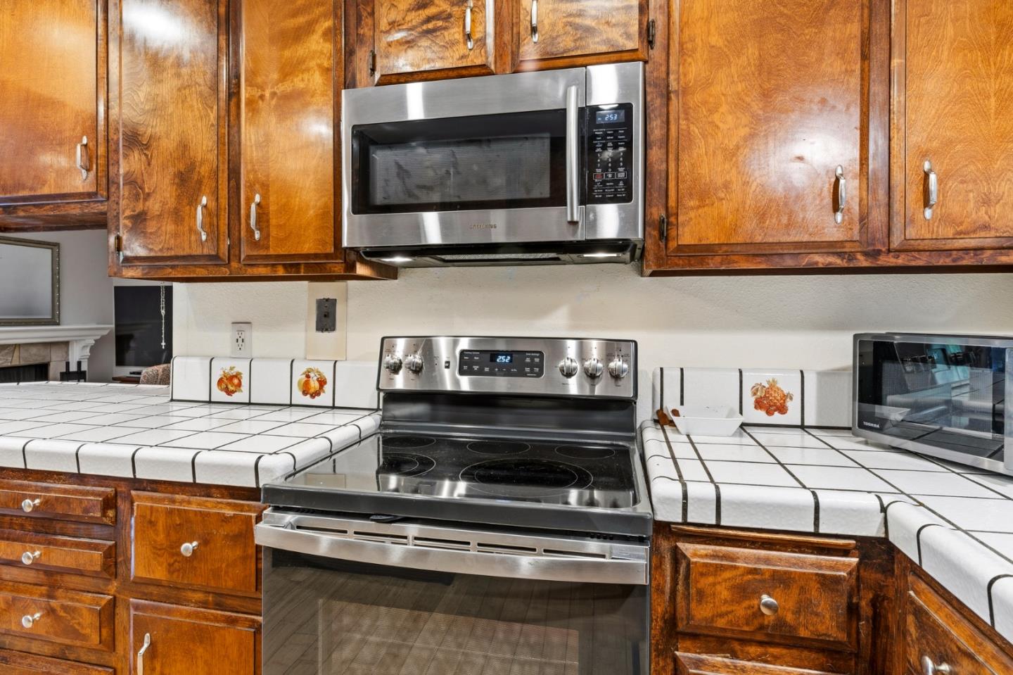 1743 Panda Way Hayward, CA 94541 - Photo 19 of 34 a kitchen with stainless steel appliances granite countertop a stove and a microwave