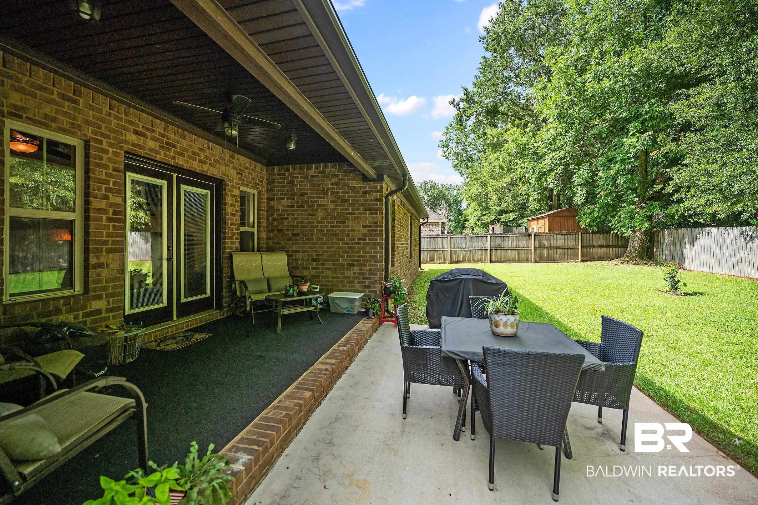 313 Pecan Ridge Boulevard Fairhope, AL 36532 - Photo 31 of 51 Covered patio featuring a ceiling fan and recessed lighting, with brick exterior walls and double glass doors