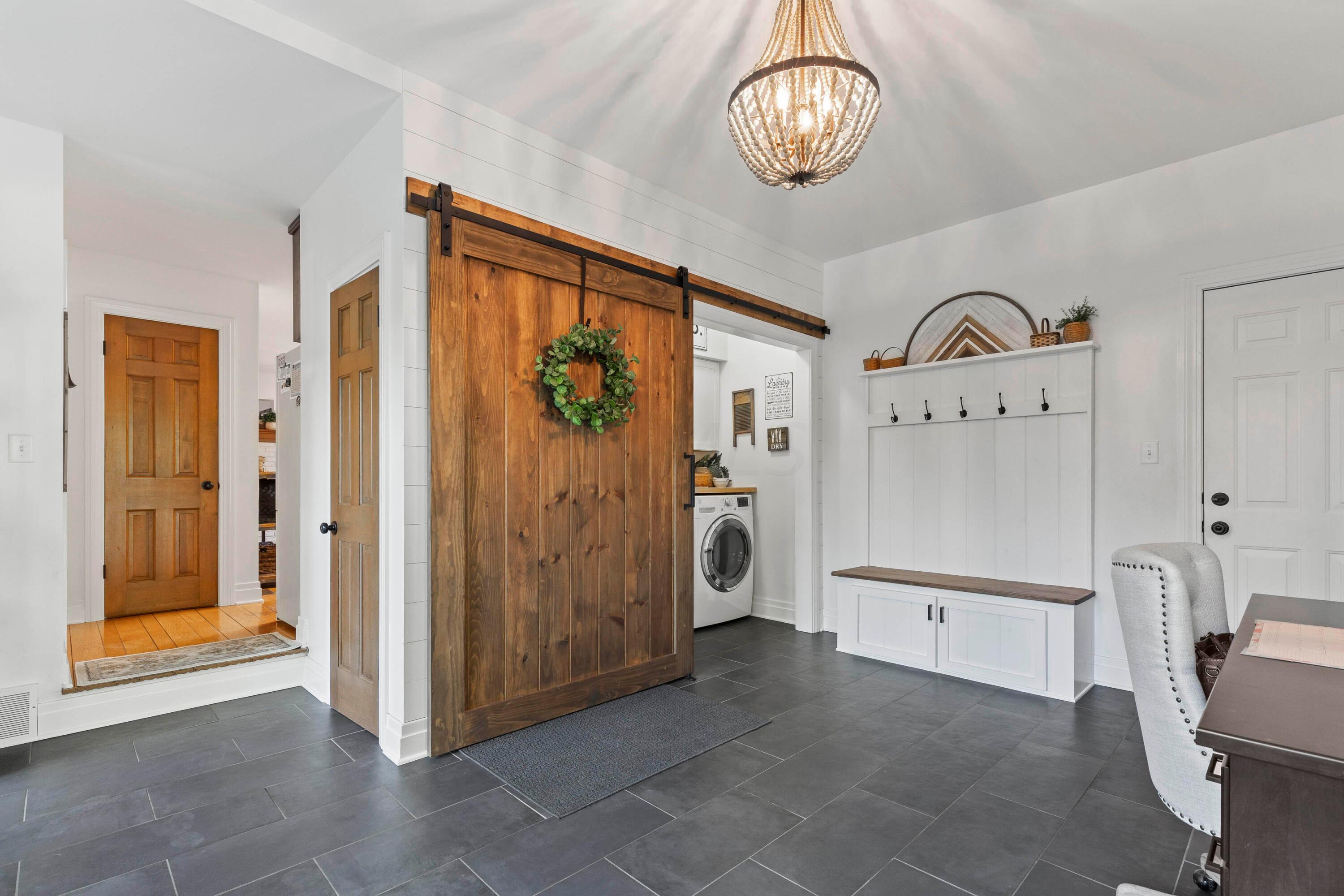 6262 Duffy Road Delaware, OH 43015 - Photo 22 of 96 • Sunken
• Ceramic tile flooring
• Ivory painted &
shiplap walls
• Ceiling light
• Sliding door to deck
• Built-in bench seat