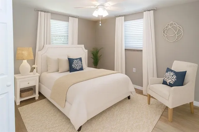 a bedroom with a bed and window