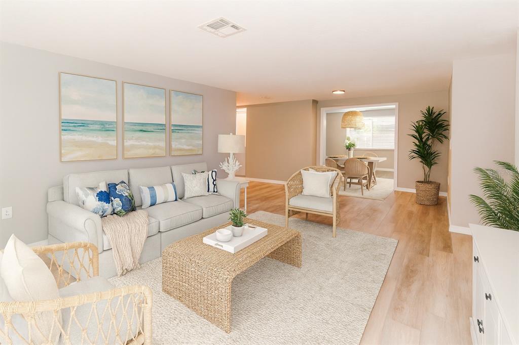 8313 Gulf Way Hudson, FL 34667 - Photo 6 of 27 a living room with furniture and a large window
