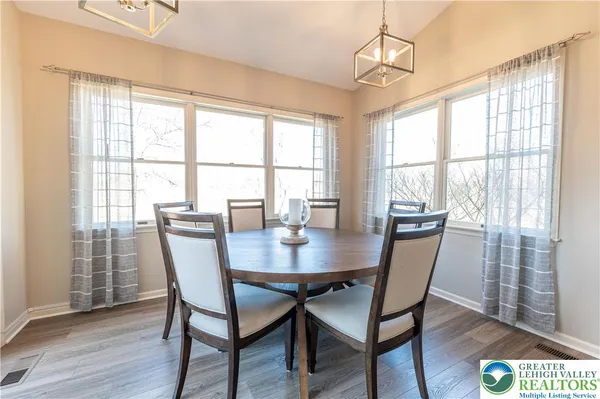 a view of a dining room with furniture window and outside view